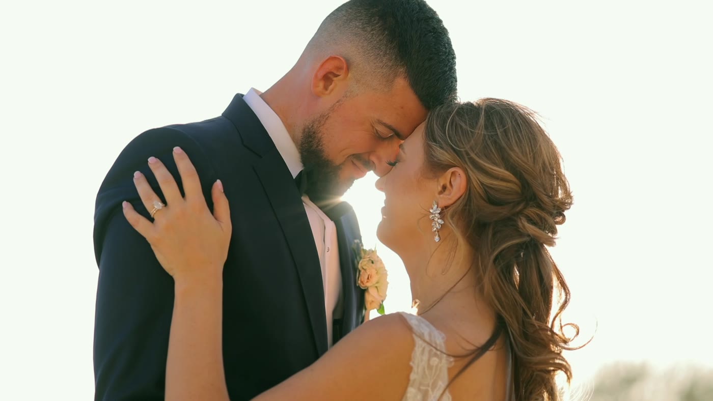 Erin and Peter sharing a quiet embrace